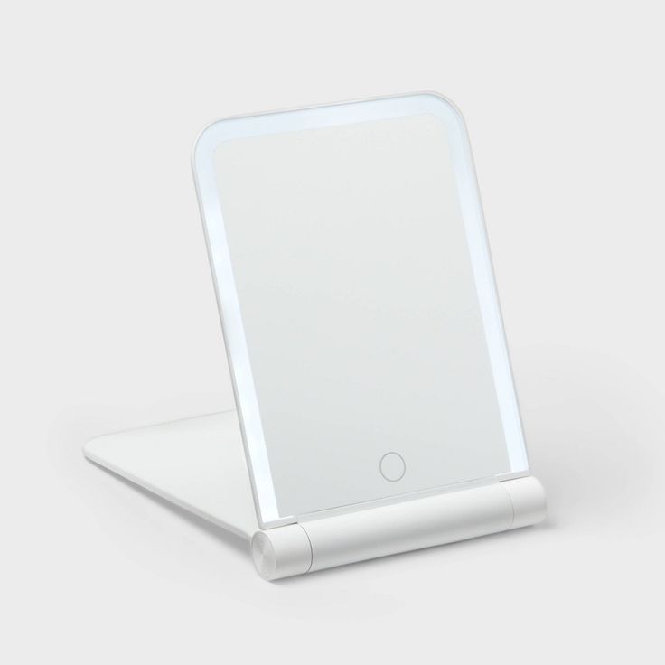 an electronic device with a white surface on it's back end and side view