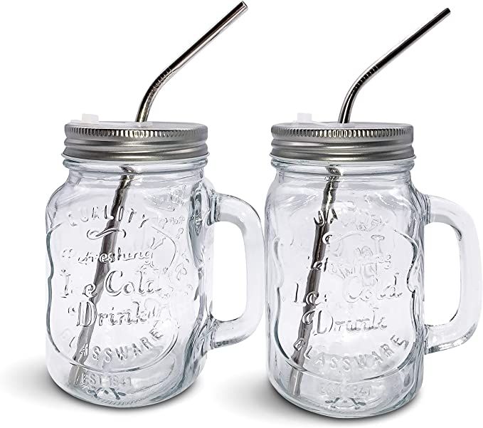 two mason jars with lids and straws on the top one has a metal lid