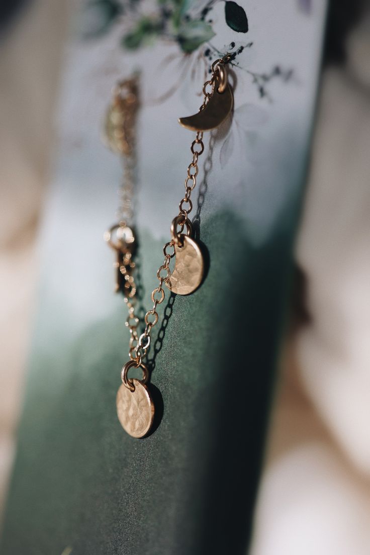 A minimalist dainty piece that you can wear every day, lovely on its own or layered with other necklaces. Each moon is unique, with the prettiest hand hammered texture. The moon phases are a sweet representation of the passage of time, and the seasons of our life waxing and waning. To me the five little moons represent my little babies, which feels especially sweet to me as I leave the baby phase and enter a new phase with them. Time is fleeting and these little moons remind me to enjoy every ch Dainty Half Moon Charm Necklace, Spiritual Moon Charm Jewelry For Everyday, Spiritual Jewelry With Moon Charm For Everyday, Adjustable Moon Shaped Jewelry For Everyday, Everyday Spiritual Moon Charm Jewelry, Minimalist Jewelry With Adjustable Half Moon Chain, Minimalist Jewelry With Moon Charm, Delicate Moon Phase Round Pendant Jewelry, Bohemian Jewelry With Moon Charm For Everyday