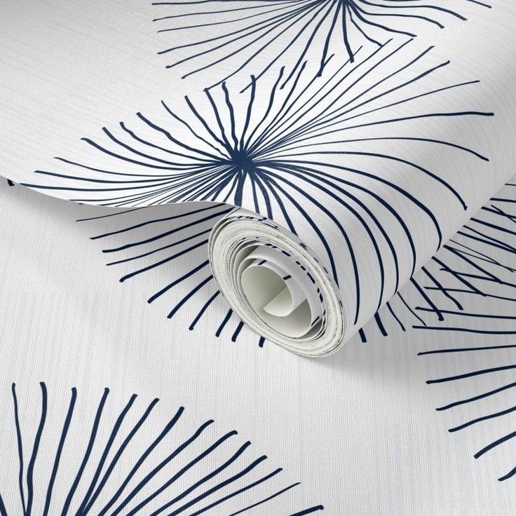 a white and blue wallpaper with palm leaves on it