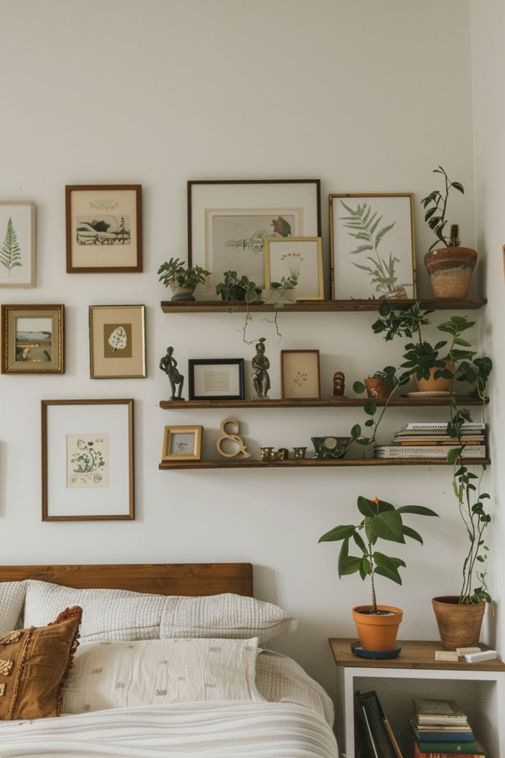 a bedroom with many plants and pictures on the wall