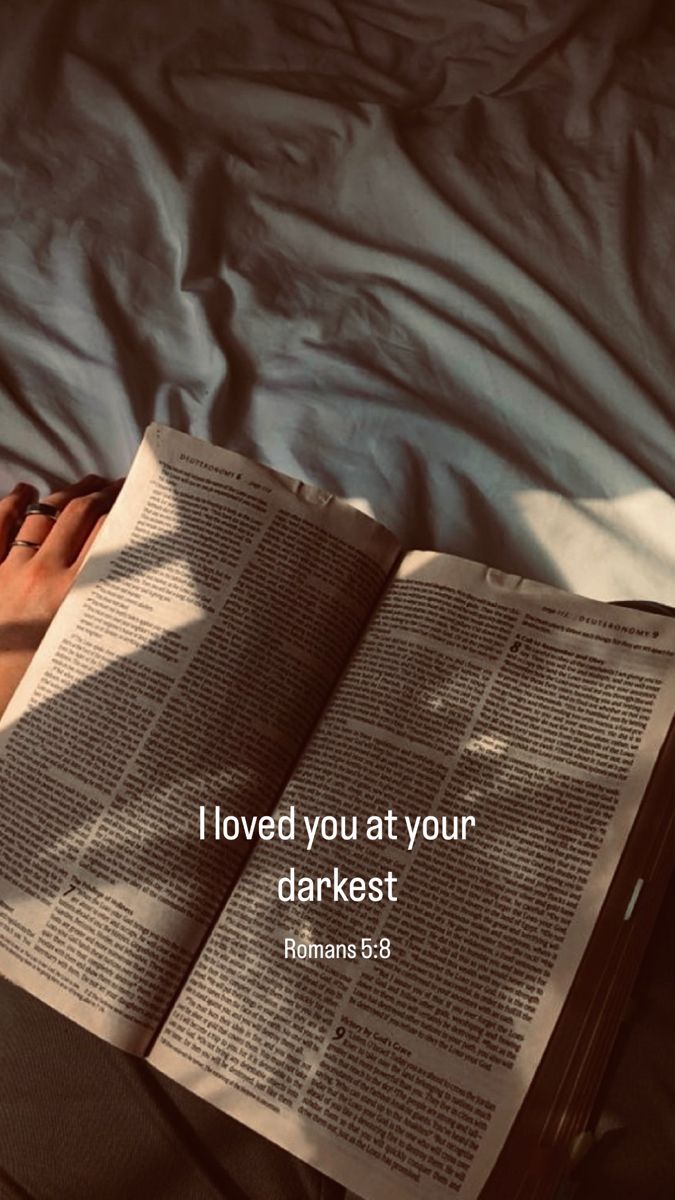 a person laying in bed reading a book with the words i loved you at your darkest