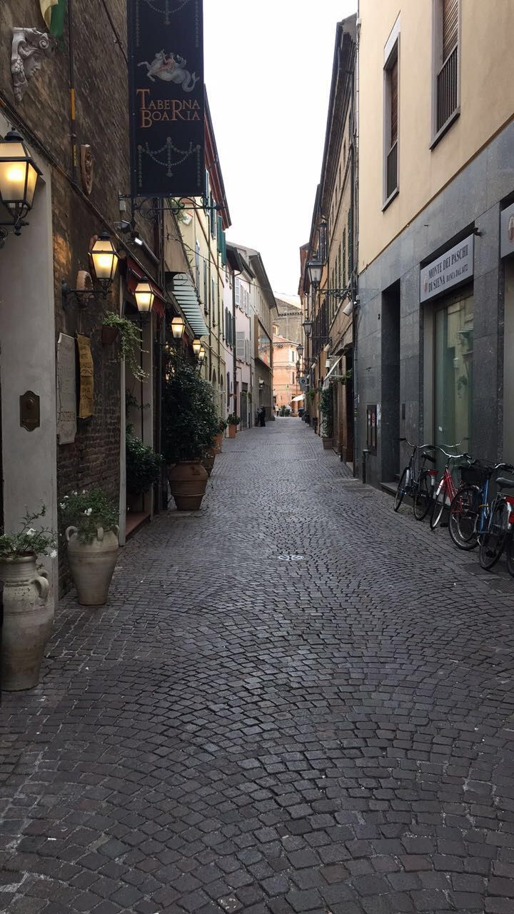 a cobblestone street in an old european city