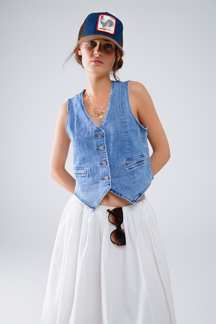 The Fitted Denim Vest is a staple piece for any wardrobe, providing versatility and style. Made from high-quality denim, it offers durability and comfort. With its timeless design, it can be dressed up or down for any occasion. Add it to your collection today. 4 button front closure Decorative pockets V-neck Faux welt pockets Material Cotton elastane blend Machine washable Classic Washed Denim Top For Spring, Spring Relaxed Fit Denim Top With Snap Buttons, Spring Washed Denim Vest For Workwear, Relaxed Fit Denim Top With Button Closure For Spring, Spring Washed Denim Vest For Work, Casual Cotton Jeans With Snap Buttons, Light Wash Denim Top With Buttoned Pockets For Spring, Washed Blue Button-up Denim Vest For Summer, Spring Denim Top With Buttoned Pockets In Medium Wash