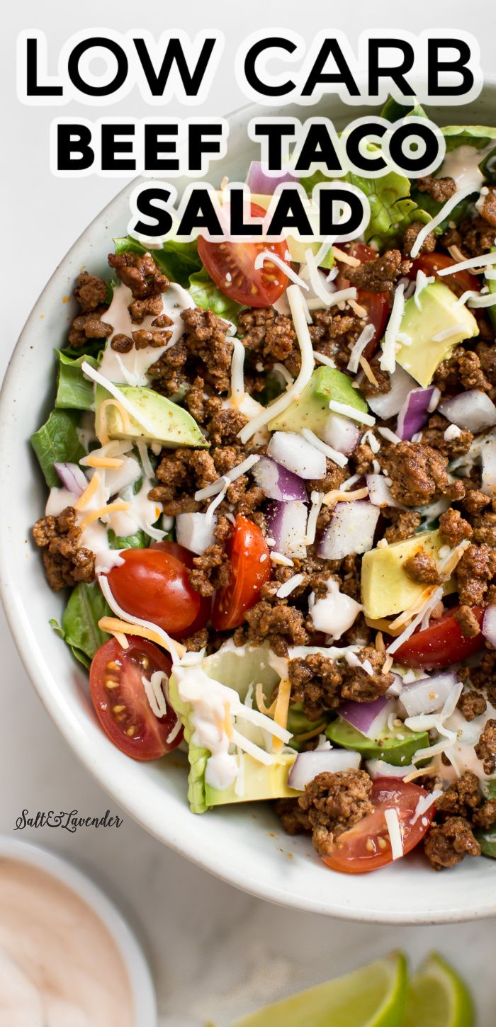 a white bowl filled with meat and vegetables