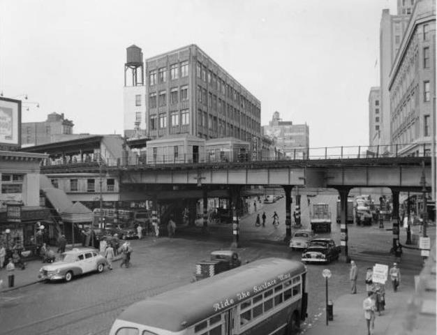 an old black and white photo of a city street