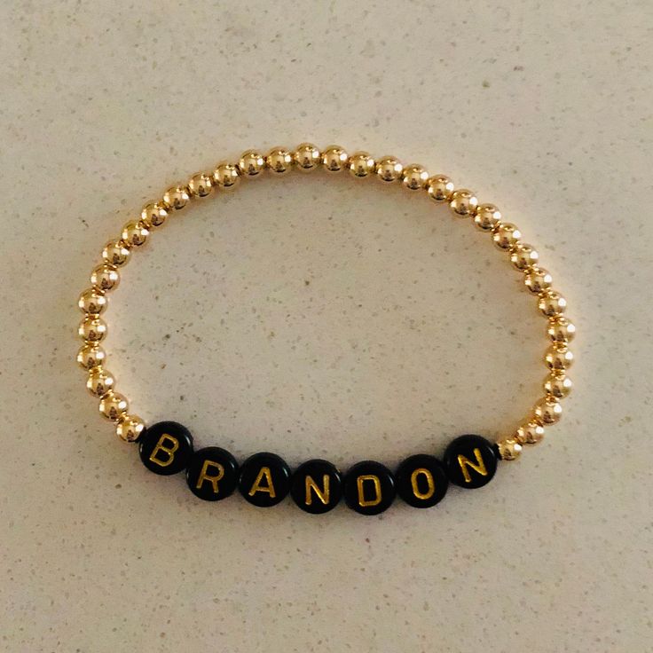 This listing is for 1 custom 14k gold filled 4mm beaded bracelet with black beads with gold letters. Each bracelet can be personalized with a name of your choice along with your desired length. Please leave a note in the comments section when you check out stating what letters you would like. Letter beads will all be placed together with gold beads on either side. These bracelets will not tarnish and look great alone or in a stack! Bracelets come in an organza pouch and make perfect gifts. I wil Classic Personalized Beaded Bracelets For Everyday, Elegant Personalized Black Name Bracelet, Elegant Black Personalized Name Bracelet, Classic Gold Jewelry With Letter Beads, Personalized Black Minimalist Beaded Bracelets, Personalized Minimalist Black Beaded Bracelets, Minimalist Personalized Black Beaded Bracelets, Classic Black Customizable Jewelry, Minimalist Name Bracelet With Round Letter Beads