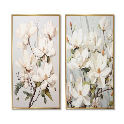 two framed paintings with white flowers on them