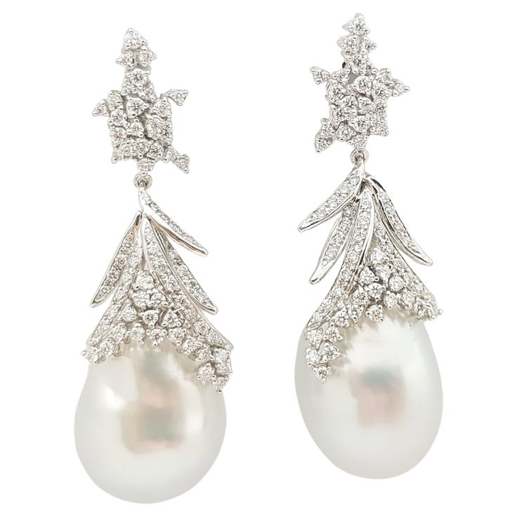 South Sea Pearl with Diamond 0.80 carats Earrings set in 18 Karat White Gold Settings Width: 1.5 cm Length: 8.0 cm Total Weight: 19.36 grams South Sea Pearl: 15.3 mm "We first opened doors in 1980 when it was then situated in the vicinity of the Victory Monument; a small and modest storefront with a couple of counters. From its humble beginnings to where it stands today, our company has proven its abilities as a jeweler. Since the beginning, we have been supplying fine quality pieces to dealers, Luxury Pear-shaped Diamond Evening Earrings, Luxury Pear-shaped Diamond Earrings For Evening, Pear-shaped Evening Diamond Earrings, Luxury Pear-shaped Earrings With Diamond Accents, Pear-shaped Diamond Earrings For Formal Events, Luxury Pear-shaped Diamond White Diamond Earrings, Luxury Pear-shaped Diamond White Earrings, Luxury Platinum Pearl Earrings For Formal Occasions, Luxury Pear-shaped Earrings For Formal Occasions