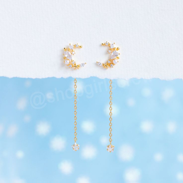 These earrings really are something out of this world. Make a bold statement with our Moonlight Dangle earrings. Dainty, but filled with so much detail, these beauties will leave everyone seeing stars. 18k gold plated, 18k rose gold plated, or rhodium plated over brass with a protective coating Cubic zirconia stones and glass pearls 1.75" drop from back, 12.7mm x 9.9mm crescent moon stud Earring post is approximately 1cm Sterling silver posts and butterfly backing Extra butterfly earring backs i Whimsical Gold Earrings With Moon Charm, Celestial Dangle Earrings With Moon Charm, Celestial Gold Plated Earrings With Moon Charm, Star-shaped Moon Charm Earrings For Party, Gold Moon-shaped Celestial Crystal Earrings, Butterfly Earring, Moon Studs, Necklace Chain Lengths, Earring Post