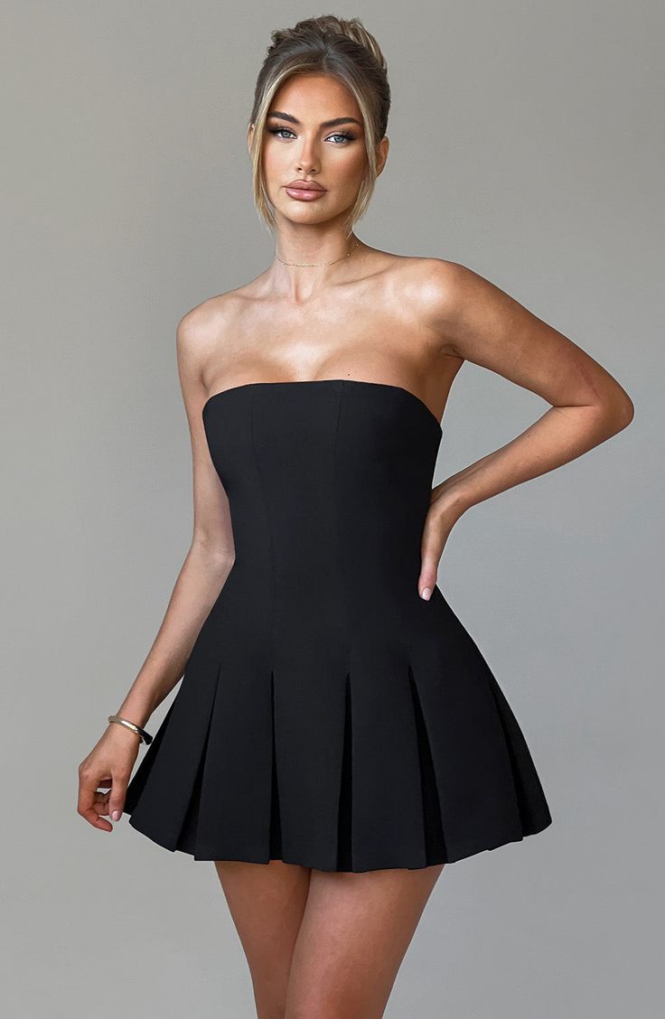 This mini IS the moment. Cut from our premium crepe fabric. Bryony has a strapless neckline and is fitted through the bust and waist for a super flattering fit. It flares gently at the skirt with box pleat detailing. Pair with cute loafers for daytime chic or heeled mules and minimal jewellery to dress her up.   Colour: Black. Premium non-stretch crepe. Fully lined. Strapless neckline. Fitted on bust and waist. Panelled seam detail. Box pleat skirt. Invisible zipper to back. Mini length. Model is an XS and is wearing an XS. Cute Loafers, Minimal Jewellery, Box Pleat Skirt, Pleat Skirt, Maxi Dress Sale, Strapless Neckline, Sparkle Dress, Solid Color Dress, Mini Dresses For Women