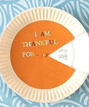 an orange and white paper plate with the words i am grateful for it on it