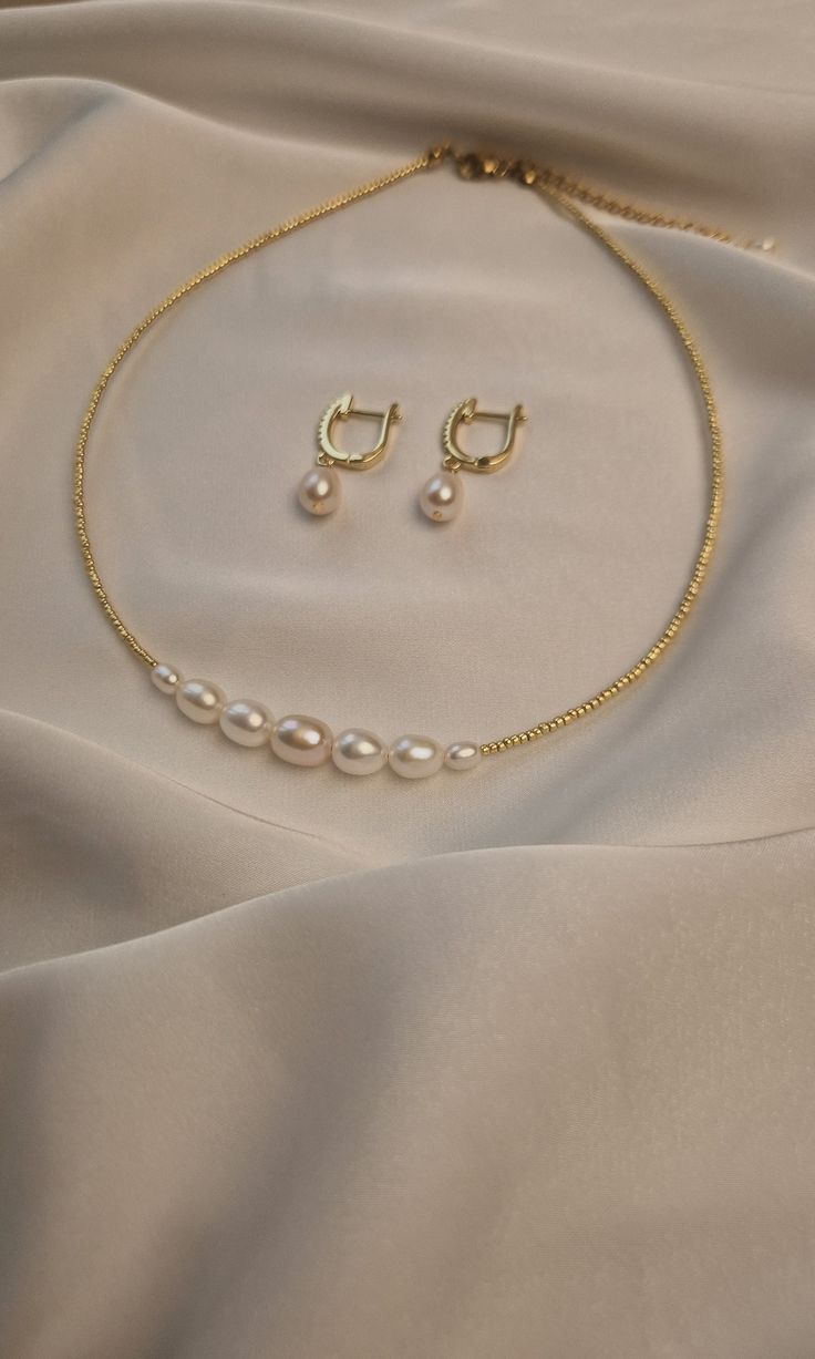 Enhance your elegance with the real pearl earrings and beaded pearl choker necklace, a stunning combination of timeless beauty and modern sophistication. This exquisite set features a minimalist choker adorned with lustrous pearls, perfectly complemented by delicate pearl earrings that add a touch of refined glamour to any ensemble. This wedding accessories exudes luxury and charm, making it an essential addition to your jewelry collection. Whether you're attending a wedding, a special event, or Gold And Pearl Wedding Jewelry, Elegant Gold-plated Bridal Necklace, Elegant Gold Plated Bridal Necklace, Elegant Pearl Necklace, Elegant Pearl Jewelry With Gold Beads, Elegant Formal Pearl Necklace With Gold Beads, Elegant Gold Pearl Choker, Elegant Pearl Necklace With Gold Beads, Elegant Gold Bridal Necklace With Gold Beads