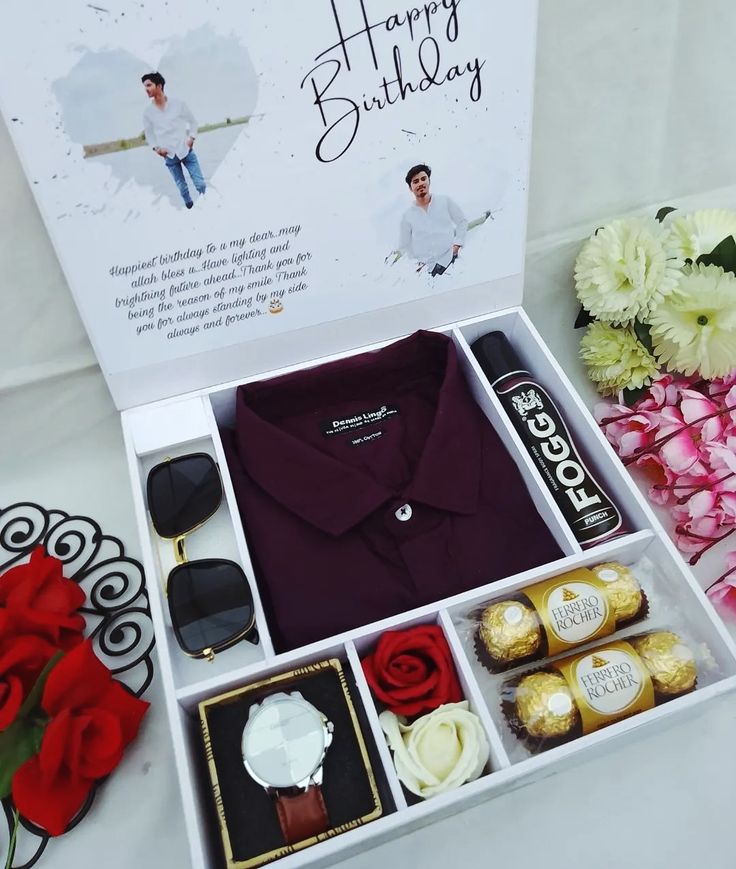 a gift box containing a shirt, chocolates and flowers with the words happy birthday written on it