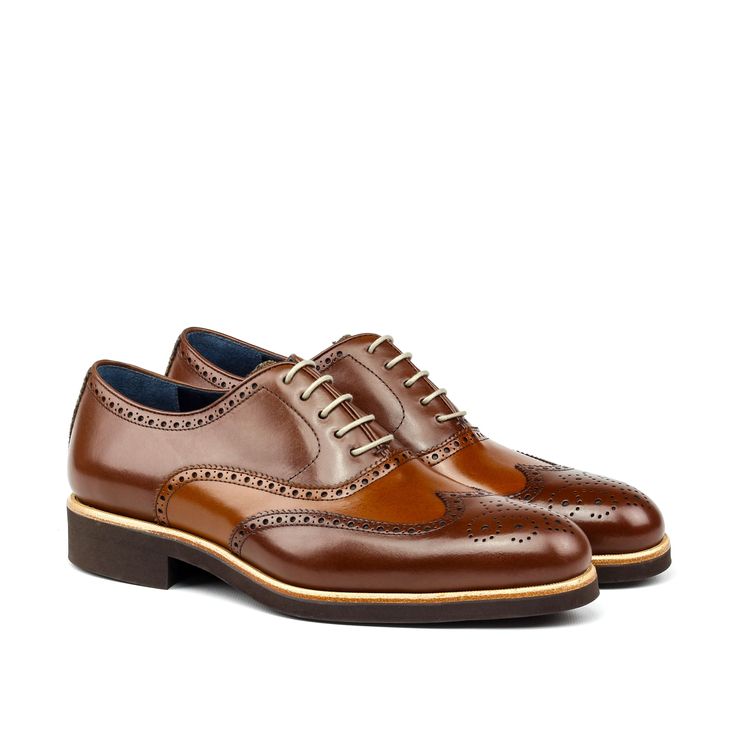 Also known as a wingtip, the Full Brogue is easily identifiable as one of the most classic pairs of men's dress shoes on the market. Featuring a brogue pattern along the sides as well as the toe cap, every man needs a Full Brogue in his shoe closet. Sole units (different available) are Blake stitched to uppers. Upper Materials: Herringbone Sartorial + Cognac Painted Calf + Med Brown Painted Calf Lining: Navy Calf Leather Sole: Brown Heeled Rubber Sole Last: Zurigo - Rounded Toe for Traditional E Brown Brogues, Jodhpur Boots, Men's Dress Shoes, Custom Made Shoes, Leather Box, Walking Sneakers, Brown Heels, Mens Dress, Coffee Brown