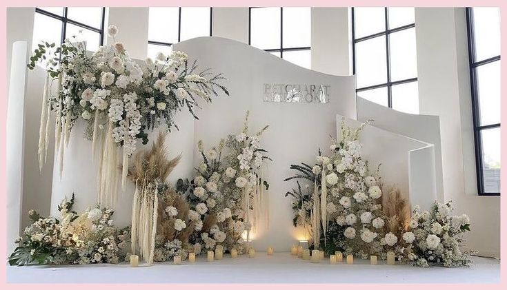 a decorated stage with flowers and candles