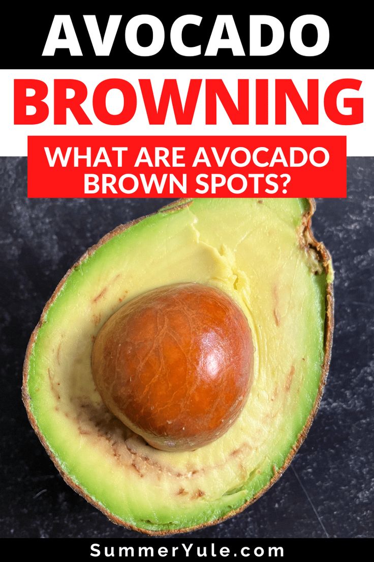 an avocado with the words, what are avocados brown spots?