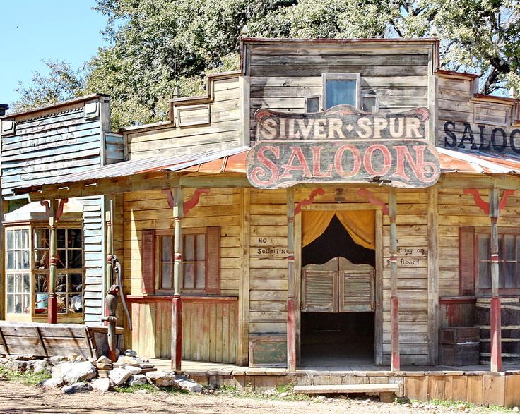 an old fashioned saloon building is featured in the web page for silver spur saloon, which has been converted into a restaurant