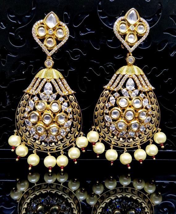 Check out this item in my Etsy shop https://www.etsy.com/listing/696479560/gold-meenakari-kundan-earring-with-cubic Gold Chandelier Earrings With Latkans For Wedding, Gold Temple Jewelry Earrings For Wedding, Gold Round Bridal Earrings For Wedding, Gold Bridal Earrings For Wedding, Gold Plated Chandelier Earrings With Intricate Design For Wedding, Gold Plated Chandelier Earrings For Wedding With Intricate Design, Gold Plated Drop Bridal Earrings In Temple Style, Gold Chandbali Jewelry Sets, Temple Jewelry Style Gold Plated Drop Bridal Earrings