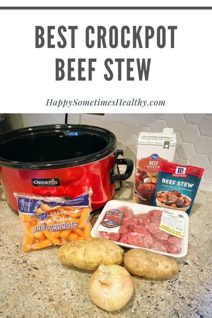 crockpot beef stew with potatoes and carrots on the counter next to it