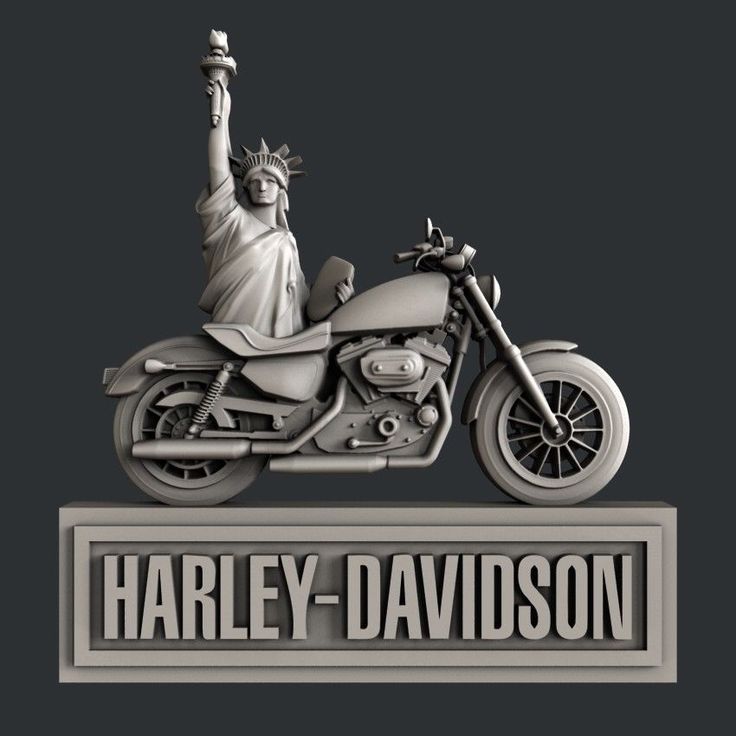 a statue of liberty on top of a motorcycle with the words harley - davidson above it