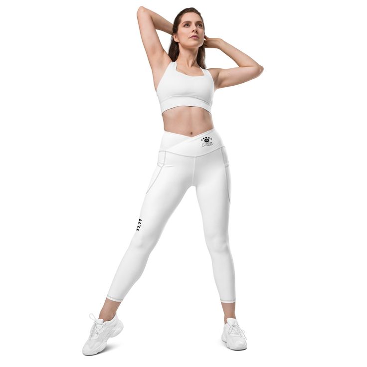 Treat yourself with the trendy and flattering crossover leggings with pockets. Feel exceptional comfort all through your training and keep your valuables close with the practical side pockets. * 74% recycled polyester, 26% elastane * UPF 50+ * Soft and stretchy fabric with a mild-compression feel * Comfortable fit * Flattering cut * High-waisted * 1 pocket on each side * Triangle gusset * Blank product components sourced from China This product is made especially for you as soon as you place an order, which is why it takes us a bit longer to deliver it to you. Making products on demand instead of in bulk helps reduce overproduction, so thank you for making thoughtful purchasing decisions! * Traceability: - Knitting--China - Dyeing--China - Manufacturing--Latvia * Contains 74% recycled poly White Sporty Yoga Pants With 4-way Stretch, White Compressive Functional Yoga Pants, Compressive Functional White Yoga Pants, Functional White Compressive Yoga Pants, Compressive White Yoga Pants, White Functional Yoga Pants, Functional White Yoga Pants, Sporty Compression Activewear With Functional Pockets, 4-way Stretch Activewear With Side Pockets For Running