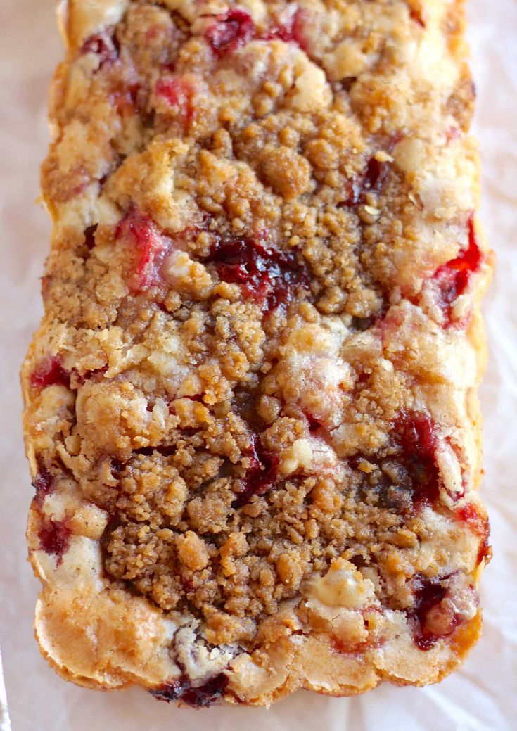 a close up of a piece of food on a paper towel with crumbs