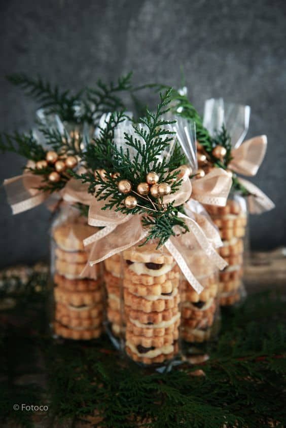 some cookies are wrapped in clear cellophane and tied with ribbon to look like pine cones