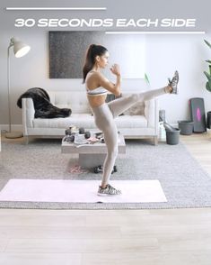 a woman is doing yoga on a mat in her living room with the words 30 seconds each side