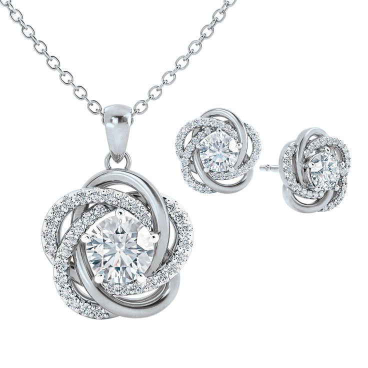 Exquisite symbols of love… This stunning silver-plated pendant features a Diamonisse simulated diamond solitaire at its center, accented by more sparkling simulated diamonds.Included in this very special offer, are perfectly matching earrings!This glittering and exceptional set features the incomparable radiance of over 85 stones and is sure to bring compliments galore, wherever it's worn.A sumptuous presentation pouch — perfect for gift-giving and safekeeping — and a matching 18" ch Cubic Zirconia Jewelry Sets For Anniversary, Diamond Accented Round Cut Jewelry Sets For Gifts, Jewelry Sets With Round Cut Diamond Accents For Gifts, Diamond Accents Jewelry Sets With Round Cut For Gift, Anniversary Jewelry Sets With Cubic Zirconia Round Cut, Diamond Jewelry Sets For Anniversary, Dazzling Sterling Silver Jewelry Sets For Anniversary, Silver Jewelry Sets With Matching Earrings For Valentine's Day, Sterling Silver Jewelry Sets For Anniversary