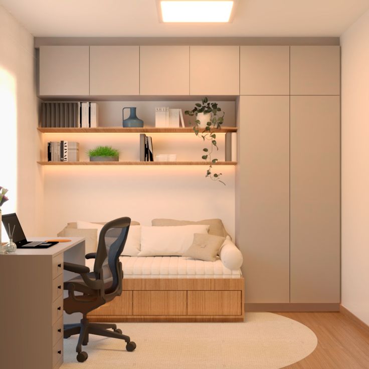 a room with a couch, desk and shelves on the wall next to each other