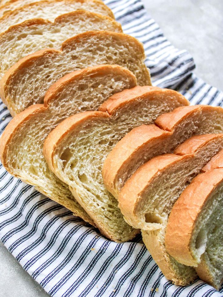 several slices of bread sitting on top of a blue and white towel