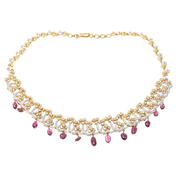 This 18K yellow gold necklace presents a dynamic design with and opulent frosting of round faceted diamonds. Suspended from the necklace are a fringe of pink tourmaline beads, adding a colorful touch to the piece. Diamonds are approximately 8.0 TCW. Hook style clasp Marks: Unmarked, Tested as 18K Dimensions: 16" L x 1" W Weight: 45.1 Gross dwt Vintage Choker Necklace, Vintage Choker, Yellow Gold Necklace, Fringe Necklace, Tourmaline Beads, Dynamic Design, Lorde, Pink Tourmaline, Vintage Necklace