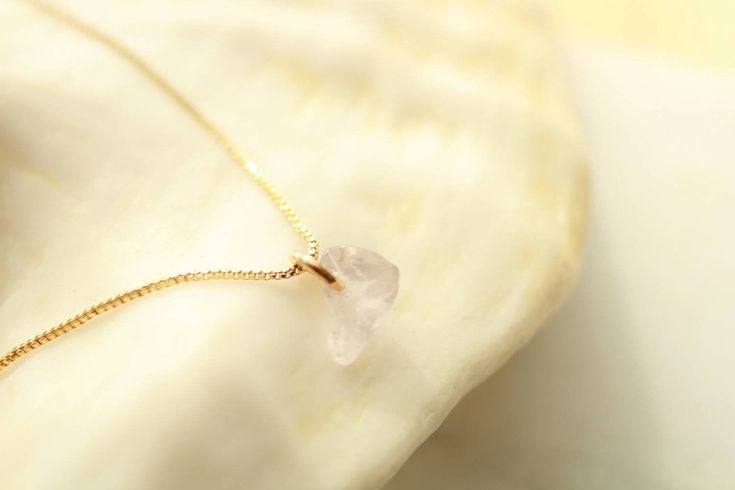 A tiny Rose quartz necklace to represent love This minimalist necklace features a tiny Rose Quartz sets on a dainty 18k gold filled chain. This beautiful necklace makes the perfect gift for Mom, bridesmades or simply for yourself! Choose your favorite chain length: 14, 16, 18, 20 inches GEMSTONE ▪Rose Quartz is known as the stone of love. ▪Rose Quartz approx 1 mm to 2 mm ▪ Due to the one-of-a-kind nature of the stones, they may vary slightly in color, hue and reflection. CHAIN AND METAL Made wit Selenite Jewelry, Selenite Necklace, Peridot Color, Peridot Necklace, Necklace Stone, Necklace Love, Love Jewelry, Rose Quartz Necklace, Tourmaline Jewelry