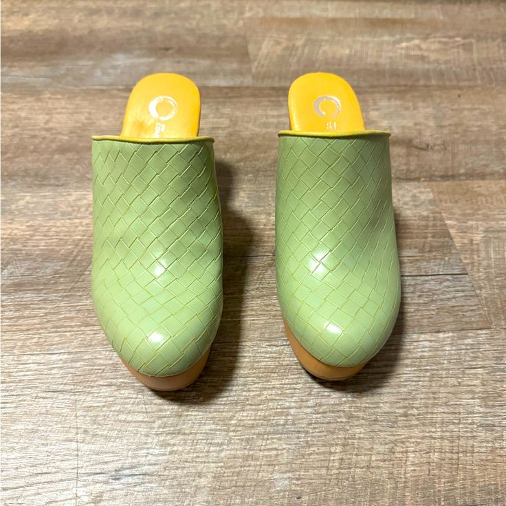 Brand New Green Clogs Size :6 Color : Green Never Worn Before Casual Green Heels With Round Toe, Green Heels With Wooden Heel For Spring, Spring Green Heels With Wooden Heel, Yellow Synthetic Mules With Round Toe, Green Slip-on Synthetic Clogs, Summer Green Mules With Wooden Heel, Green Synthetic Mules With Round Toe, Green Synthetic Slip-on Clogs, Spring Closed Toe Synthetic Clogs