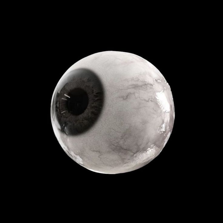 an eyeball is shown in the middle of a black and white photo with grey background