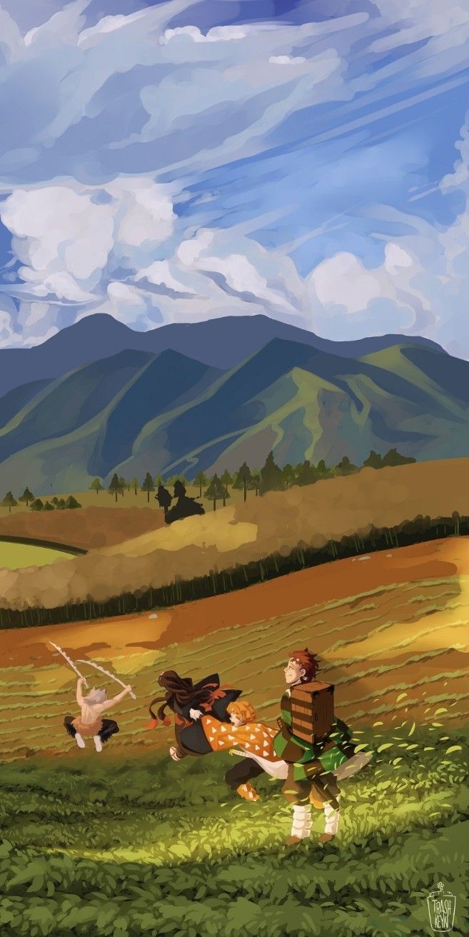 two people are in the middle of a field with mountains in the background and one person is holding a box