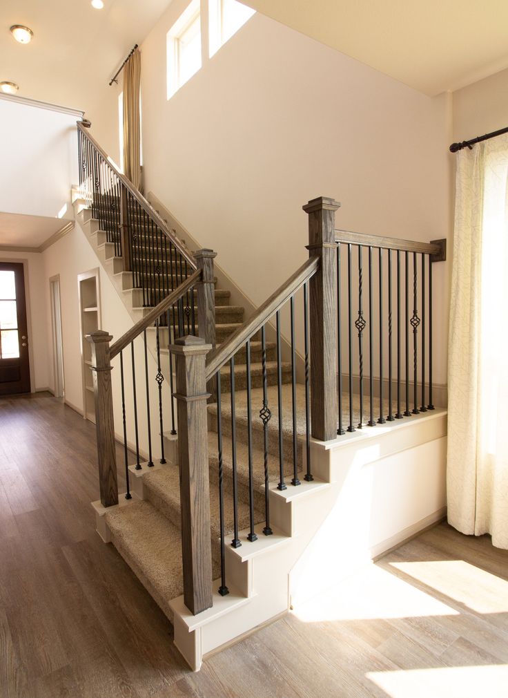 a staircase in a house with wooden floors