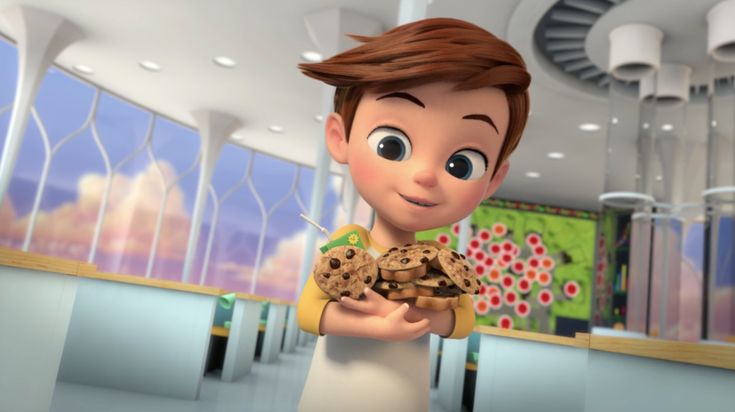 a cartoon boy holding some cookies in his hands and looking at the camera with an excited look on his face