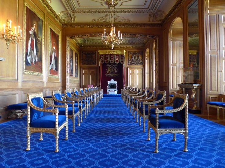 rows of chairs lined up in an ornately decorated room