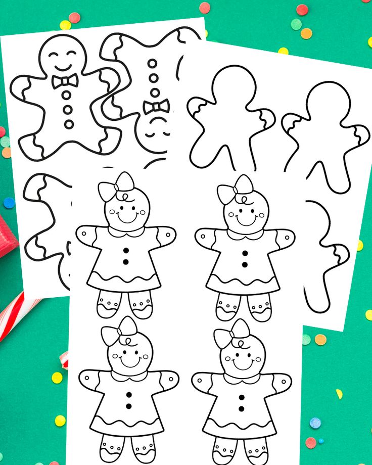 two coloring pages with gingerbreads and candy canes on the table next to them