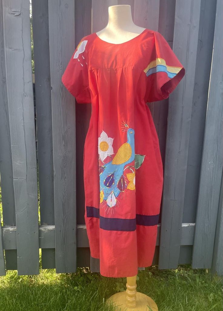 Beautiful Vintage Mexican handmade cotton dress with embroidered floral, peacock, rainbow andsunny cloud design. Relaxed fit, A-line, scoop neckline, half sleeves, ankle length and has pockets! 100% Cotton Excellent vintage condition  Fits best Women's Large - Large/ XL Measurements taken flat across in inches: neck: 8" shoulders: 20" bust: 25" waist: 27" length: 42" Floral Peacock, Mexican Embroidered Dress, Cloud Design, Clouds Design, Holiday Beach, Vintage Mexican, Summer Holiday, Embroidered Dress, Dress Clothes For Women