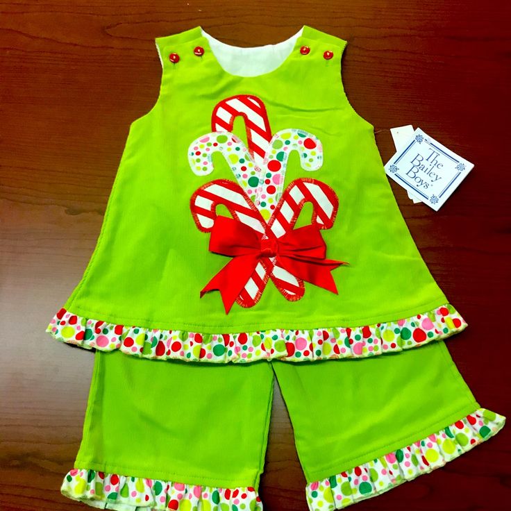 The Is A New With Tags From The Bailey Boys Angel Dress Outfit. It Is A Size 6 Month. “Candy Cane”. The Top If Fully Lined. Buttons At The Shoulders With Ruffles At The Hem. Pants Have Elastic In Waist And Ruffles At The Hem. Green Cotton Christmas Sets, Green Cotton Sets For Holiday, Fun Green Cotton Set, Playful Cotton Sets For Holiday, Cute Cotton Holiday Dresses, Sleeveless Cotton Dress For Christmas, Playful Cotton Christmas Dress, Cute Cotton Holiday Sets, Cute Cotton Sets For Holidays