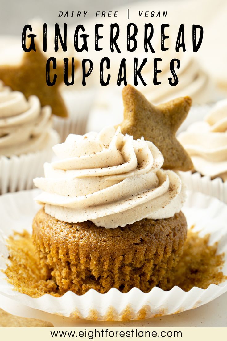 some cupcakes with white frosting and cinnamon stars on top are sitting on paper plates