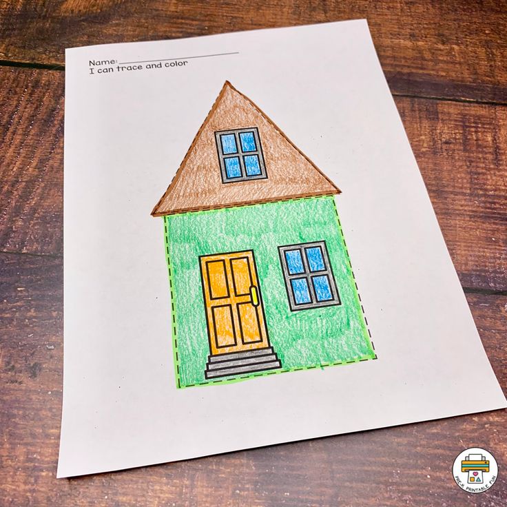 a child's drawing of a house on paper