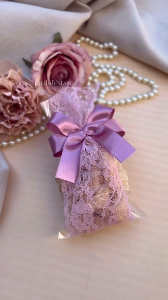 two pieces of lace and flowers on a table