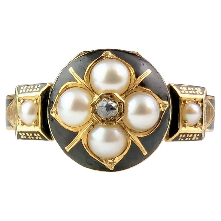 Did you ever lay eyes on such a wonderfully detailed and beautiful mourning ring. I was so excited for this piece to arrive being a lover of mourning jewels and it does not disappoint, everything about it is a work of art. It features a rich 18ct yellow gold band, fully hallmarked and decorated with black enamel depicting the words in Memory Of around the band, the shoulders are raised with small square mounts, finely enameled and each set with a small pearl. The face is not just beautifully designed it is also a hinged locket face, opening up much like the old infamous poison ring design, enclosing two locks of finely woven hair. The front of the locker face is decorated with black enamel and set with four lustrous, plump split pearls with a diamond point to the centre to create a forget Black Enamel Ring For Wedding, Victorian Oval Enamel Ring For Anniversary, Antique Black Enamel Jewelry For Wedding, Victorian Memorial Jewelry Ring, Victorian Enamel Ring For Anniversary, Victorian Black Enamel Rings For Anniversary, Victorian Black Enamel Anniversary Rings, Heirloom Jewelry With Round Black Enamel, Black Enamel Round Jewelry For Weddings