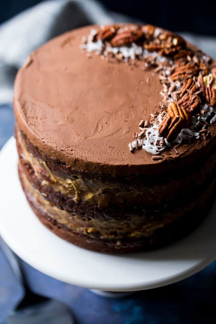 there is a chocolate cake with pecans on top