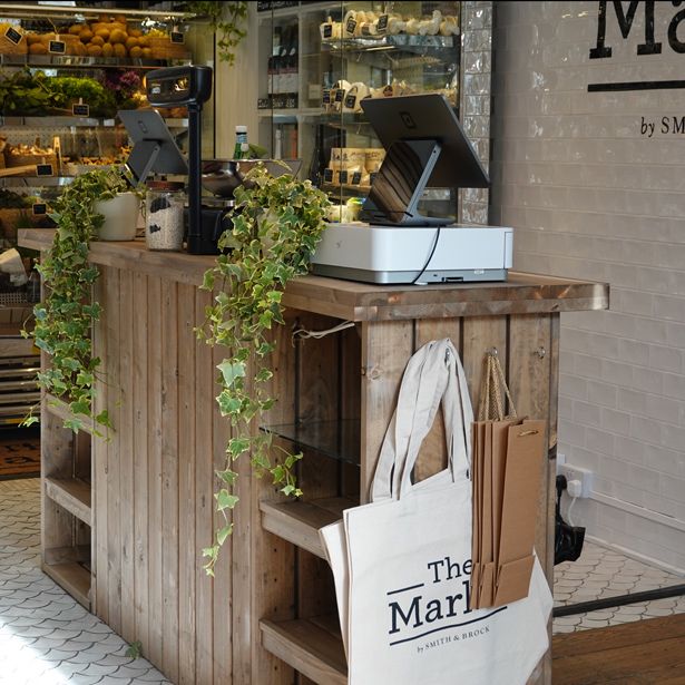 there is a bag sitting on the counter in front of the store's window