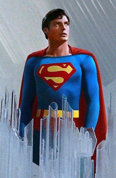 a man dressed as superman standing in front of an ice - filled cityscape